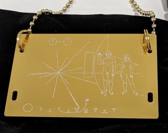 NASA Pioneer Plaque pendant - necklace - laser engraved. Comes in a black velvet pouch. Includes 80cm ball chain. Can be customised!