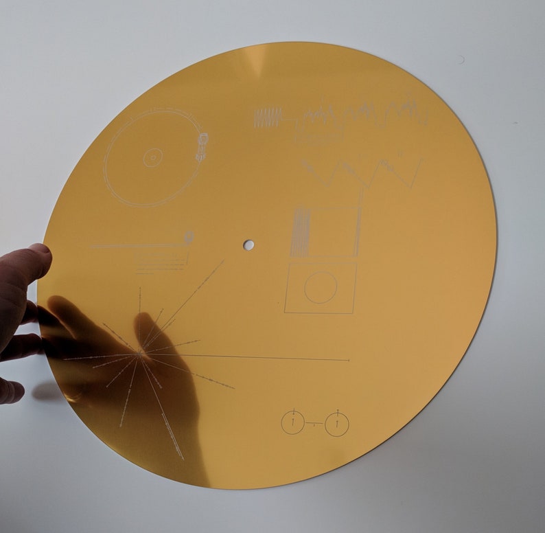 Full size metal replica of NASA Voyager Golden Record cover, laser engraved on aluminium. Celebrate the Voyager missions Glossy with hole