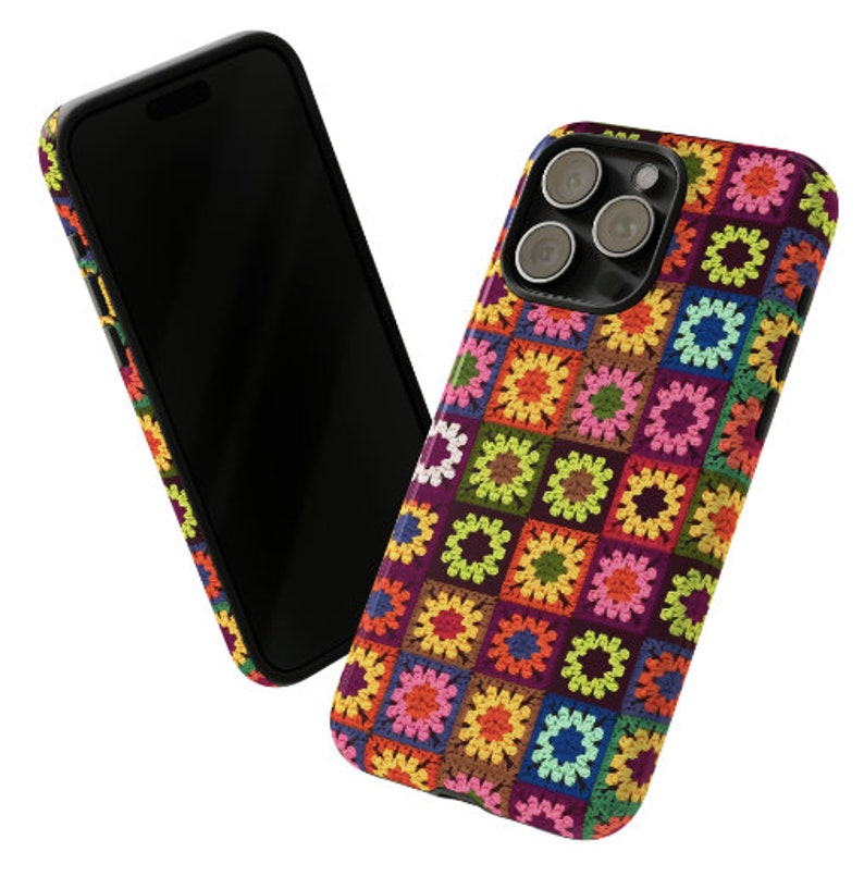 May include: A colourful phone case with a crocheted pattern in shades of pink, green, yellow, blue, and brown. The case has a black border and a cutout for the phone's camera.