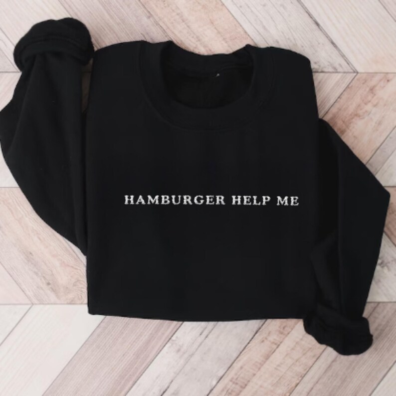 May include: Black sweatshirt with the text "Hamburger Help Me" in white lettering.
