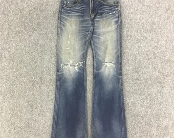 Pantalones vaqueros Bono de estilo vintage con corte bota, parte trasera y patchwork desgastado.