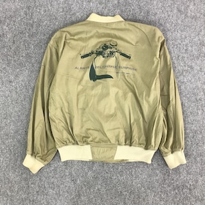 May include: A white ceramic mug with a black handle and the text "But First, Coffee" in a black, bold font. The mug is on a white surface.