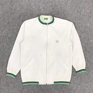 May include: White zip-up jacket with green and cream trim on the collar, cuffs, and hem. A small green emblem is on the chest. The jacket has two front pockets and a full-length zip.