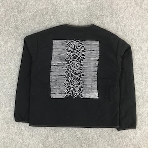 May include: Black long-sleeved jacket with a white graphic on the back. The graphic is a stylized, linear representation of a mountain range. The jacket has a quilted texture and a dark grey trim around the collar.