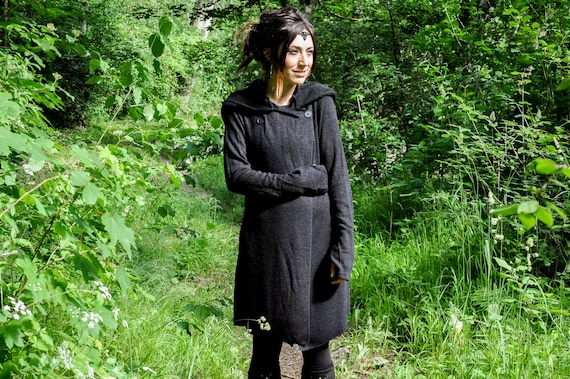 Coat with store thumb holes