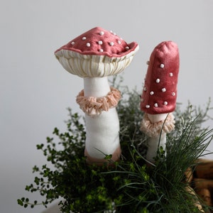 Pair of velvet mushrooms in decorative fabric Amanita muscaria