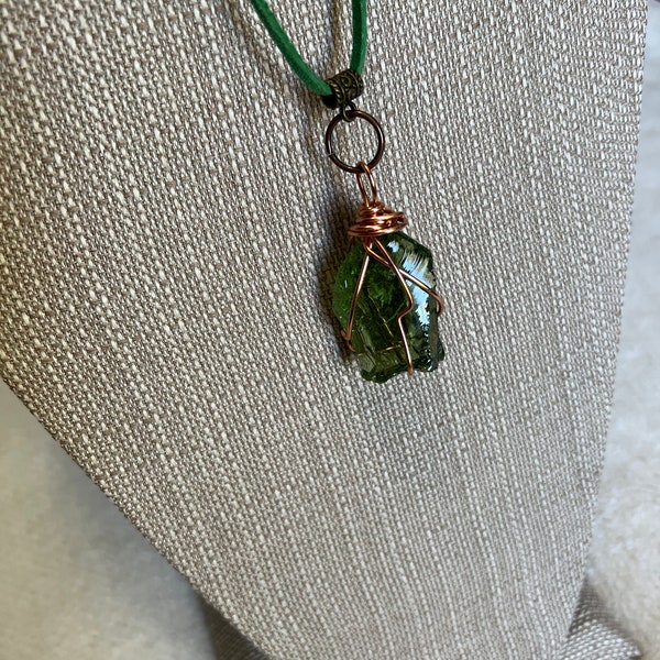 Luminescent Green Andara with a green Suede necklace.