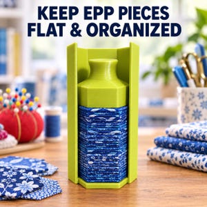 May include: A lime green plastic organizer for English Paper Piecing featuring a vertical stand with a central column and a top knob, holding a stack of blue floral fabric hexagons. The text KEEP EPP PIECES FLAT & ORGANIZED is visible above.