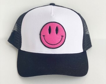 pink smiley face hat