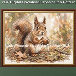 May include: A PDF digital download cross stitch pattern featuring a brown squirrel holding a nut amidst autumn leaves. The image includes the text PDF Digital Download Cross Stitch Pattern and a URL link to the CelticRoseXStitch shop.