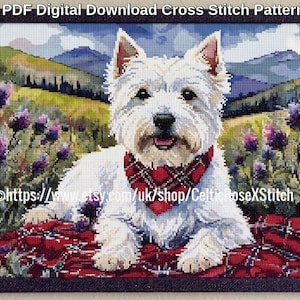 May include: A cross stitch pattern featuring a white West Highland White Terrier wearing a red plaid bandana, resting on a red plaid blanket in a field of purple thistles with mountains in the background. Text reads PDF Digital Download Cross Stitch Pattern.