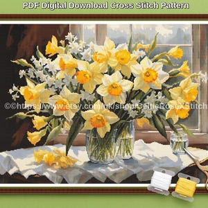 May include: A digital cross stitch pattern featuring a bouquet of yellow daffodils and small white flowers in glass vases on a white cloth. The image includes the text PDF Digital Download Cross Stitch Pattern and a URL, plus two spools of thread and scissors.