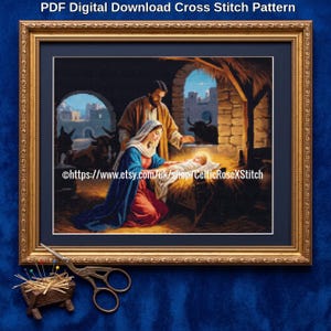 May include: A framed cross stitch pattern titled PDF Digital Download Cross Stitch Pattern featuring a nativity scene with a man and woman kneeling beside a baby in a manger. The scene includes stone arches, cattle, and a glowing light source.