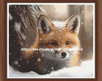 May include: A PDF digital download cross stitch pattern featuring a red fox with white fur accents on its face and ears, set against a snowy forest background with falling snowflakes. The text reads PDF Digital Download Cross Stitch Pattern.
