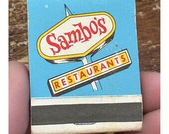 Cerillas antiguas de los restaurantes Sambo's, cubierta color turquesa, mecanismo de encendido frontal, sin usar.