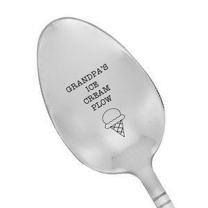 May include: A silver ice cream spoon with the text "Grandpa's Ice Cream Plow" and a small ice cream cone graphic.