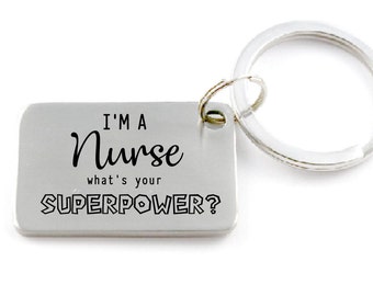 May include: Silver keychain with a rectangular tag that reads "I'm a Nurse what's your SUPERPOWER?"