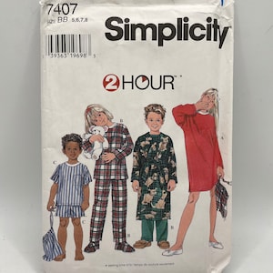 May include: Simplicity sewing pattern number 7407 for children's pajamas and a robe. The pattern includes instructions for sizes 5, 6, 7, and 8. The pattern shows a girl wearing a red nightgown, a boy wearing a plaid pajama set, a boy wearing a robe with a dog print, and a boy wearing a striped pajama set.