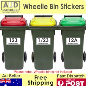 May include: Three green wheelie bins with different house numbers and the words 'Railway Street' on each. The bins have red, yellow, and green lids. The text 'AUD Stickers' is at the top of the image.