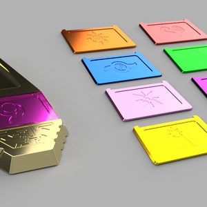 May include: A gold and purple pendant with a stylized design and a set of eight colorful square tiles with different symbols.