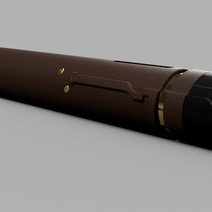 May include: A brown and black cylindrical vape pen with a gold accent. The pen has a mouthpiece on one end and a button on the other.