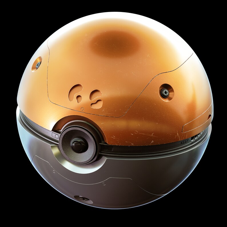May include: A round, metallic object with a gold top and a black bottom. The top has a textured surface and a circular design with the letters "KEE" visible. The bottom has a speaker and a circular design with the letters "KEEP" visible.