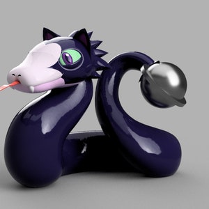 Puede incluir: Una serpiente negra y blanca con una campana en la cola. La serpiente tiene un ojo morado y verde y una lengua rosa. La serpiente está hecha de un material brillante y lustroso.