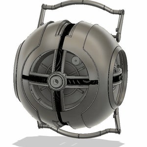 May include: A silver-colored, spherical, mechanical device with a handle and a series of gears and cogs visible through the open sections. The device appears to be a model or prototype.