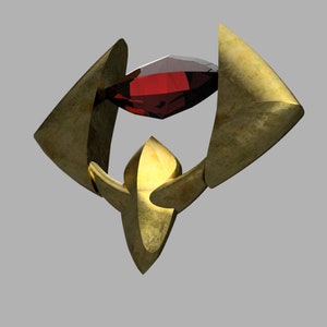 May include: A gold-colored metal pendant with a red gemstone in the center. The pendant is shaped like a stylized letter W.