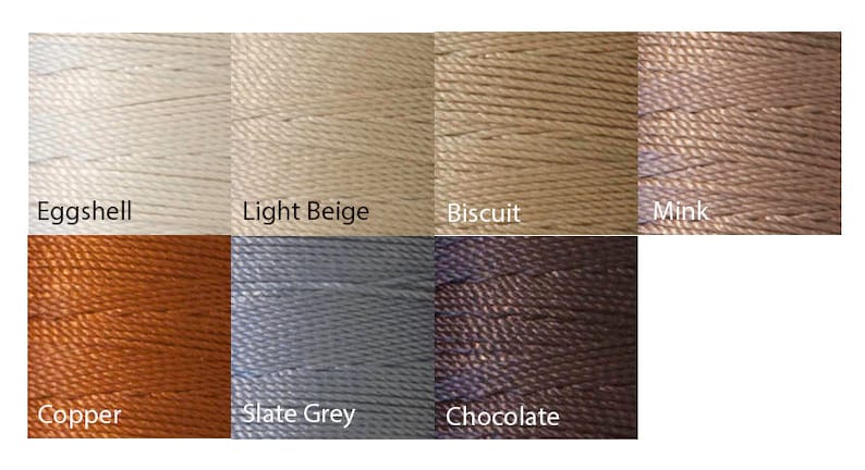 May include: A color palette of eight spools of thread, each in a different neutral shade. Colors include Eggshell, Light Beige, Biscuit, Mink, Copper, Slate Grey, and Chocolate. The thread is tightly wound and appears to be a smooth, durable material.