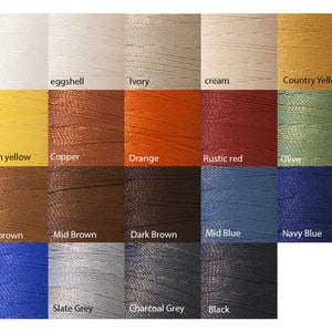 May include: A color chart showing 18 different thread colors, including white, eggshell, ivory, cream, country yellow, lemon yellow, copper, orange, rustic red, olive, light brown, mid brown, dark brown, mid blue, navy blue, blue, slate grey, charcoal grey, and black.