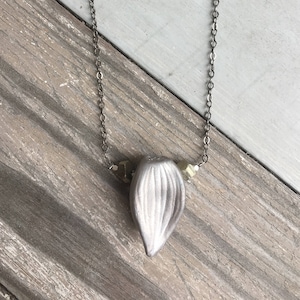 Lustered porcelain and rough pyrite crystal garlic amulet necklace