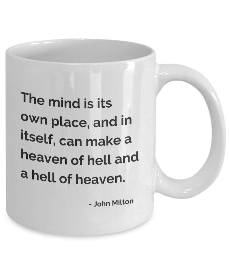 May include: White ceramic mug with a curved handle. The mug features the quote "The mind is its own place, and in itself, can make a heaven of hell and a hell of heaven." attributed to John Milton, printed in black.