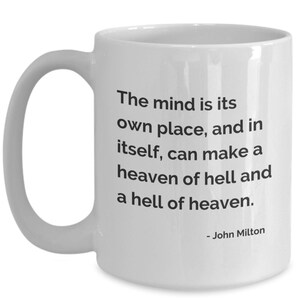 May include: White ceramic mug with a curved handle. The mug features the quote, "The mind is its own place, and in itself, can make a heaven of hell and a hell of heaven." by John Milton, in black text.