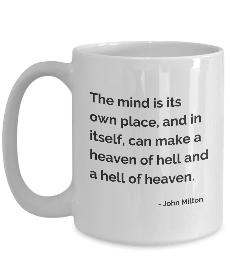 May include: White ceramic mug with a curved handle. The mug features the quote, "The mind is its own place, and in itself, can make a heaven of hell and a hell of heaven." by John Milton, in black text.