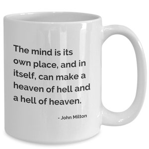 May include: White ceramic mug with a curved handle. The mug features black text that reads: "The mind is its own place, and in itself, can make a heaven of hell and a hell of heaven." The quote is attributed to John Milton.