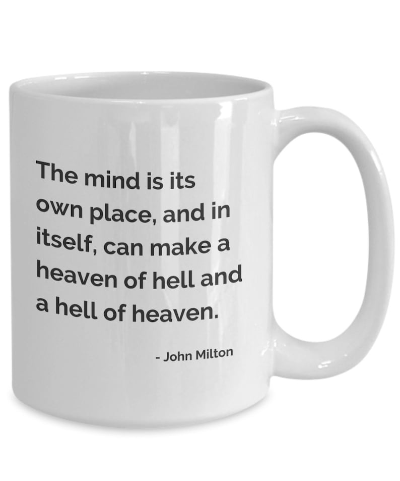 May include: White ceramic mug with a curved handle. The mug features black text that reads: "The mind is its own place, and in itself, can make a heaven of hell and a hell of heaven." The quote is attributed to John Milton.
