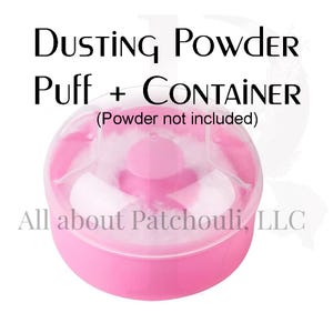 May include: A pink dusting powder container with a puff inside. The container is round with a clear top and the text "Dusting Powder Puff + CONTAINER" is printed above the container.