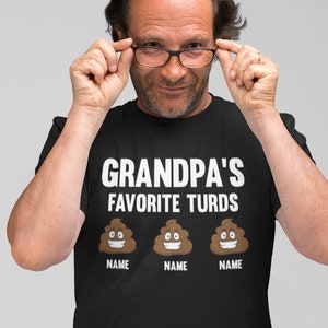 May include: Black t-shirt with the text "Grandpa's Favorite Turds" and three poop emojis with the word "NAME" under each.