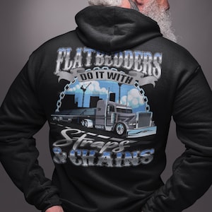 May include: Black hooded sweatshirt with a graphic of a semi-truck and the text "Flatbedders Do It With Straps & Chains".