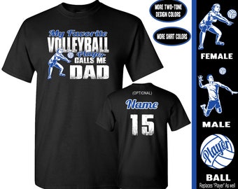 May include: Black t-shirt with white text that reads "My Favorite Volleyball Player Calls Me Dad". The shirt features a graphic of a volleyball player. The text "Name 15" is printed on a black t-shirt.