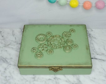 Unique upcycled trinket box with 3 dimensional decor.