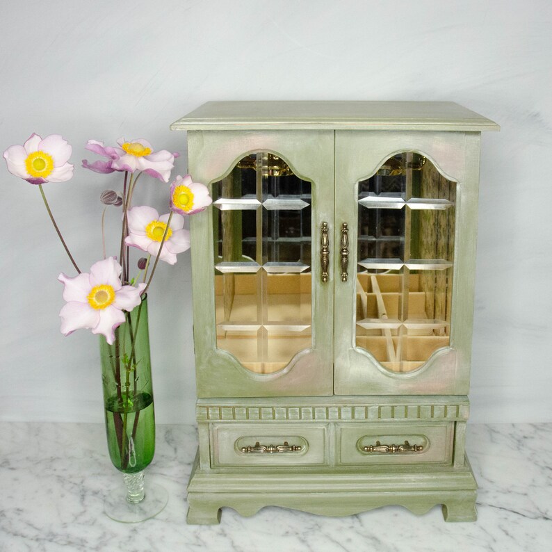 Upcycled vintage jewellery box with bevelled glass in the two door fronts.  Pale green in colour with cream and pink blended in.