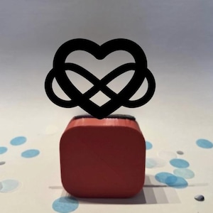 May include: A white ceramic mug with a black handle and the text "But First, Coffee" in a handwritten style. The mug is likely for hot beverages and has a glossy finish.