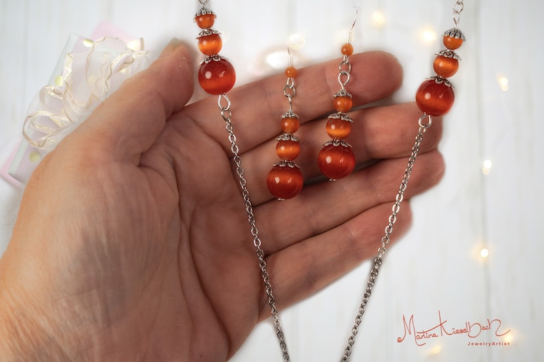 Long necklace with a large pendant and matching earrings made of orange cat/'s eye Necklace with earrings jewelry made of cat/'s eye
