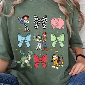 Comfort Colors Tee, Coquette Bows Toy Story Tee, Toy Story Family Shirt, Toy Story Land shirt, Toy Story Characters Tee, Disneyland Trip Tee