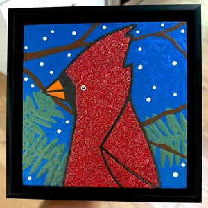 Original artwork — varnished acrylic on wood panel — “Winter Cardinal” — in a 9.5x9.5” black floater frame — ready to hang on wall to enjoy!