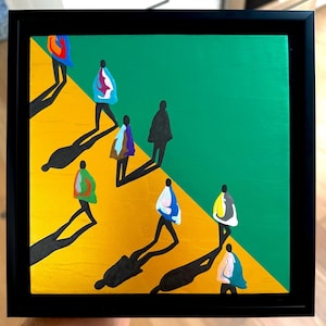 May include: Abstract painting in a black frame. The artwork depicts stylized figures walking on a yellow surface, with a green background. The figures are wearing colorful coats, and long shadows are cast on the yellow surface.