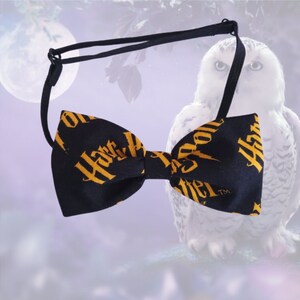 May include: A black bow tie with a gold "Harry Potter" print. The bow tie is tied and ready to wear.