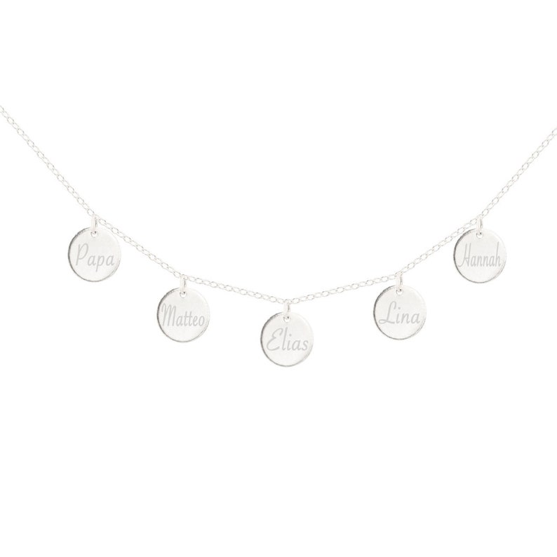 May include: Silver necklace with five round charms, each engraved with a name: Papa, Matteo, Elias, Lina, and Hannah.